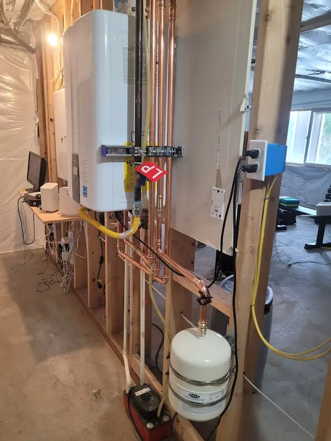 Licensed plumber repairing a kitchen sink in Brattleboro